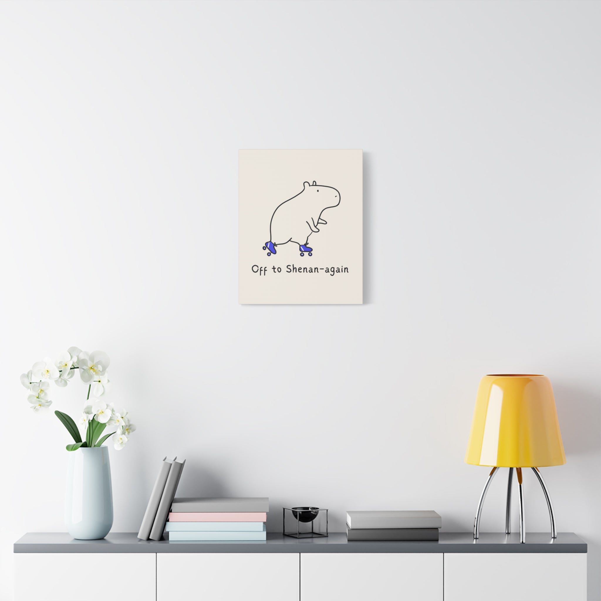 Capy Life Off to Shenan-again canvas wall art featuring a minimalist capybara on roller skates on a tan background.