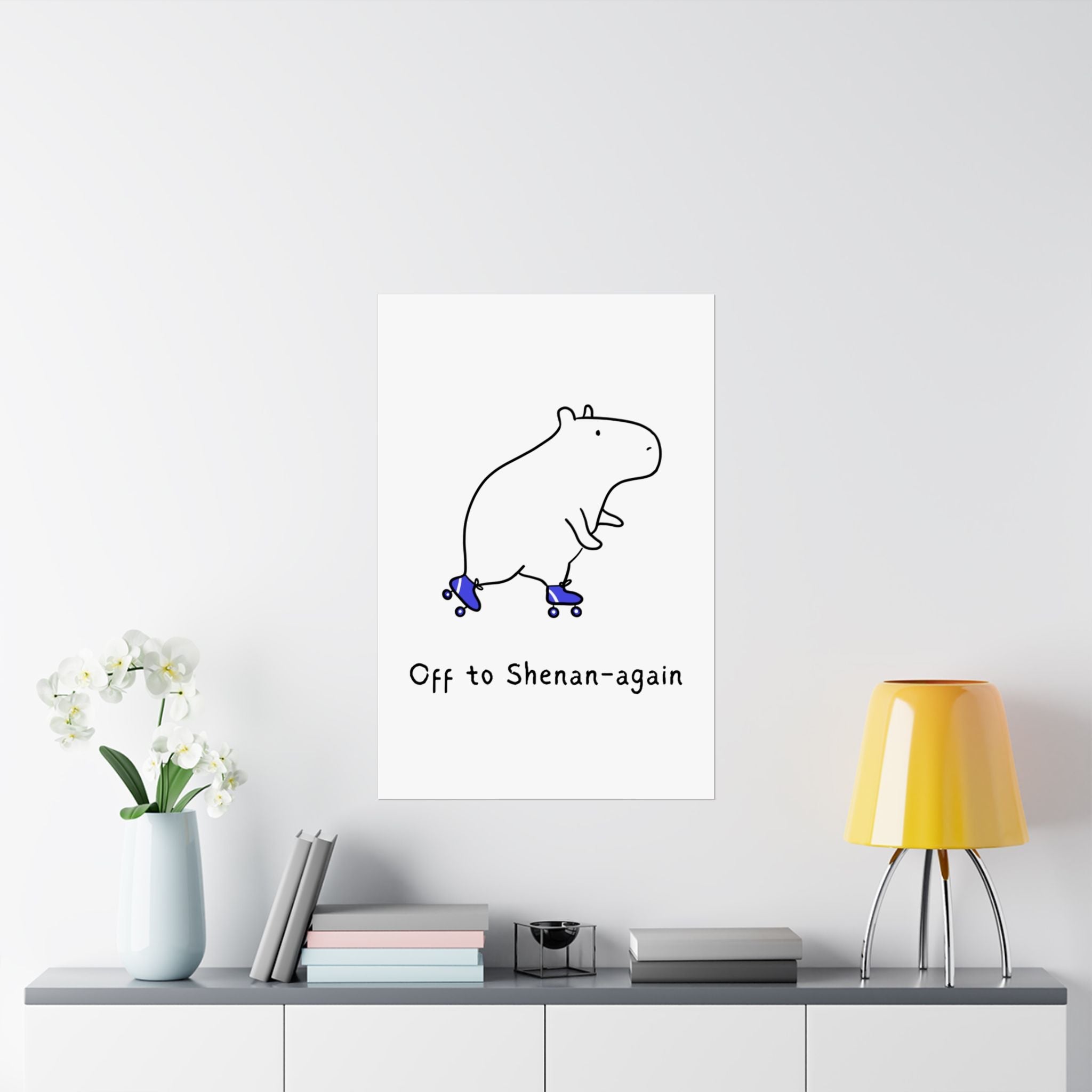 Capy Life minimalist wall art print featuring a hand-drawn capybara on roller skates with the text Off to Shenan-again