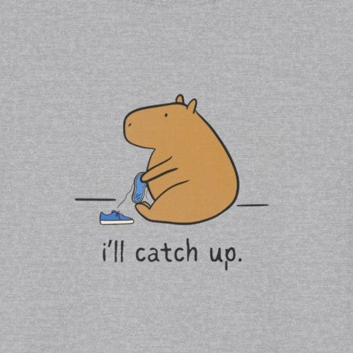 Capy Life softstyle grey t-shirt featuring a hand-drawn capybara sitting with a sneaker and text i'll catch up.