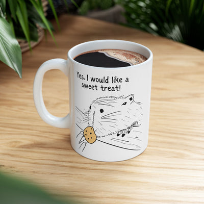 Capy Life white ceramic mug featuring a hand-drawn capybara illustration with a cookie and the text Yes I would like a sweet treat