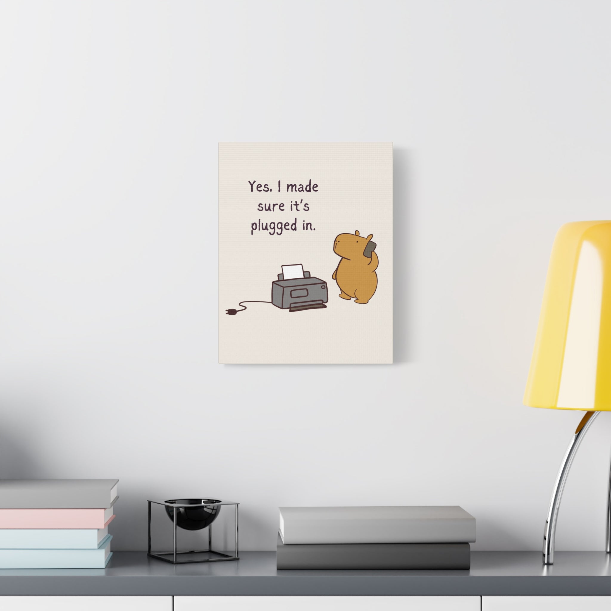 Capy Life canvas wall art featuring a cute capybara on a phone next to a printer with IT humor text on a white wall.
