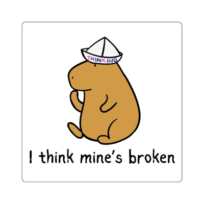 Capy Life sticker featuring a cute brown capybara wearing a paper thinking hat with the text I think mine’s broken