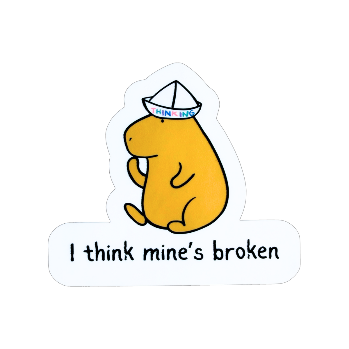 Capy Life die cut sticker featuring a yellow capybara wearing a paper thinking hat with the text I think mine’s broken