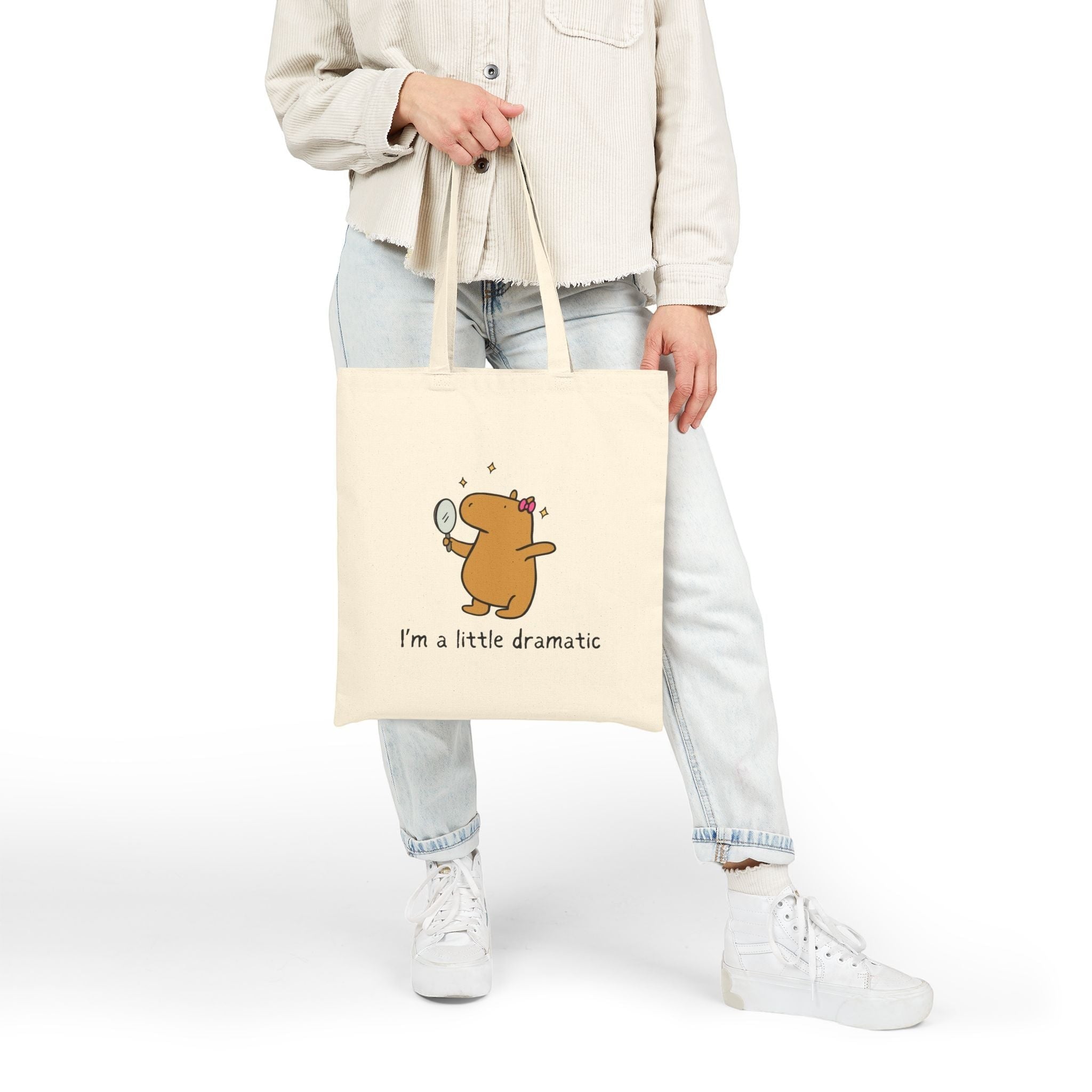 Capy Life natural cotton canvas tote bag featuring a cute capybara holding a mirror with the text I am a little dramatic