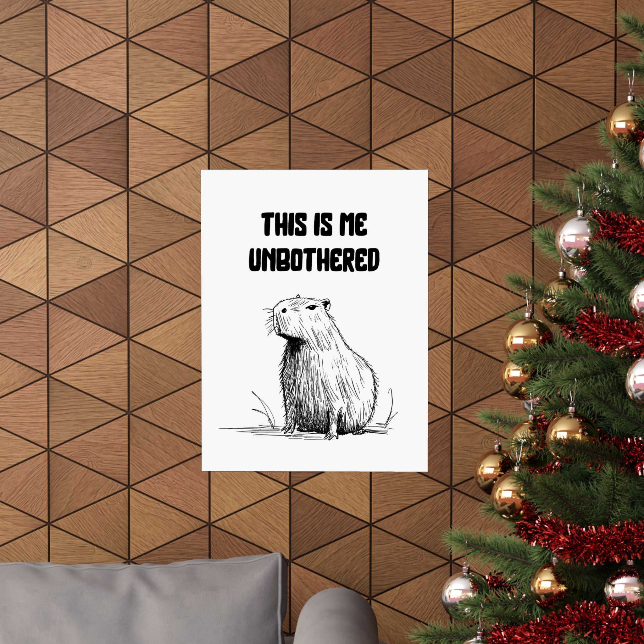 Capy Life minimalist capybara wall art print with the text This Is Me Unbothered hanging on a wood panel wall