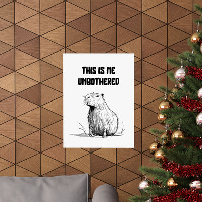 Capy Life minimalist capybara wall art print with the text This Is Me Unbothered hanging on a wood panel wall