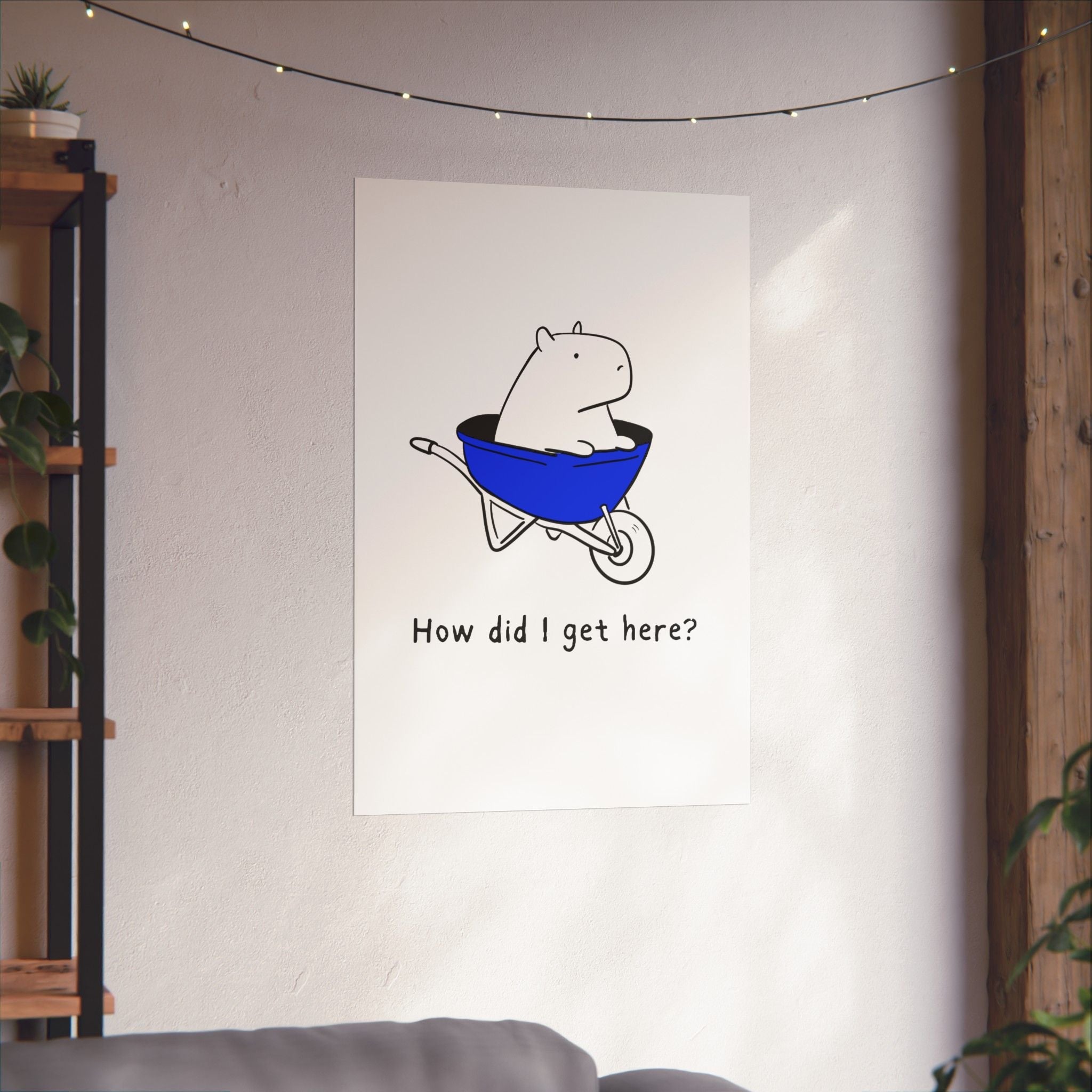 Capy Life minimalist wall art print featuring a capybara in a blue wheelbarrow with the text How did I get here?