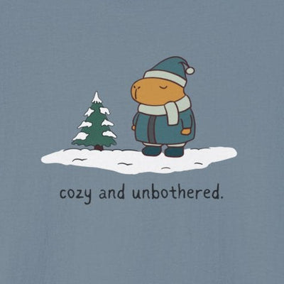 Capy Life softstyle t-shirt featuring a capybara in winter gear standing in snow with the text cozy and unbothered.