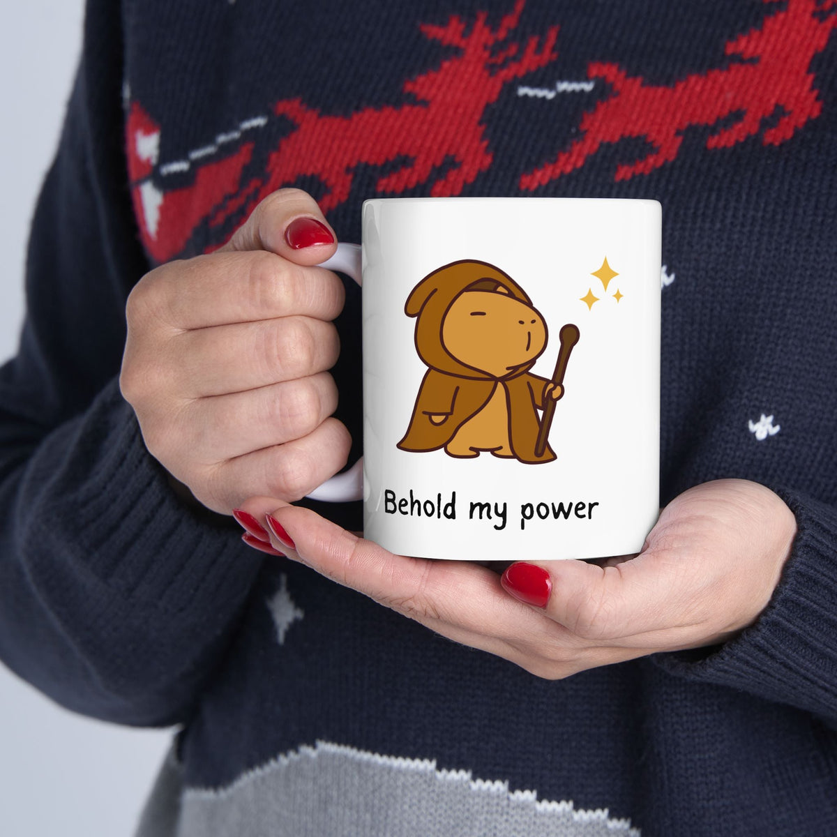 Capy Life ceramic mug featuring a cute capybara wizard in a robe holding a wand with the text Behold my power