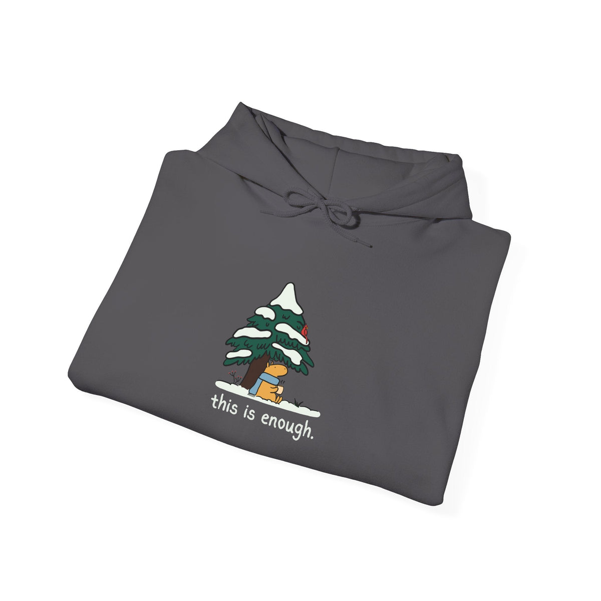 Capy Life charcoal grey pullover hoodie featuring a cute capybara in a blue scarf under a snowy evergreen tree.