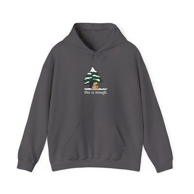 Capy Life charcoal grey pullover hoodie featuring a cute capybara under a snowy tree with the text this is enough.