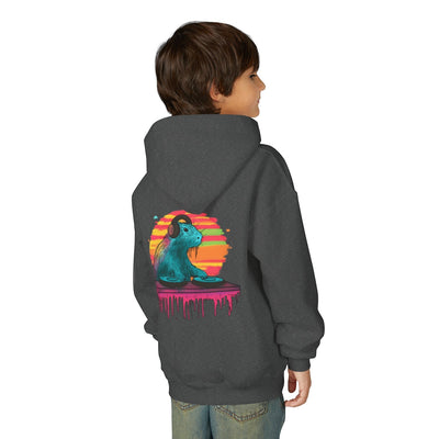 Child wearing a Capy Life charcoal grey kids hoodie with a colorful DJ capybara graphic on the back
