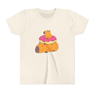 Capy Life youth tee in cream cotton featuring a cute graphic of two capybaras and a pink frosted donut