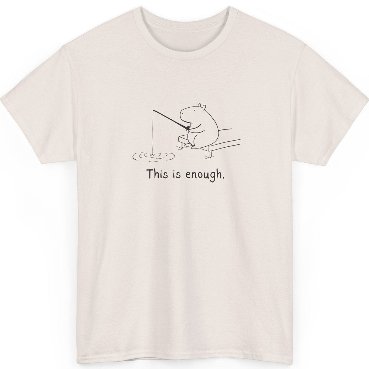 Capy Life cream heavy cotton t-shirt featuring a minimalist black line drawing of a capybara fishing with text.