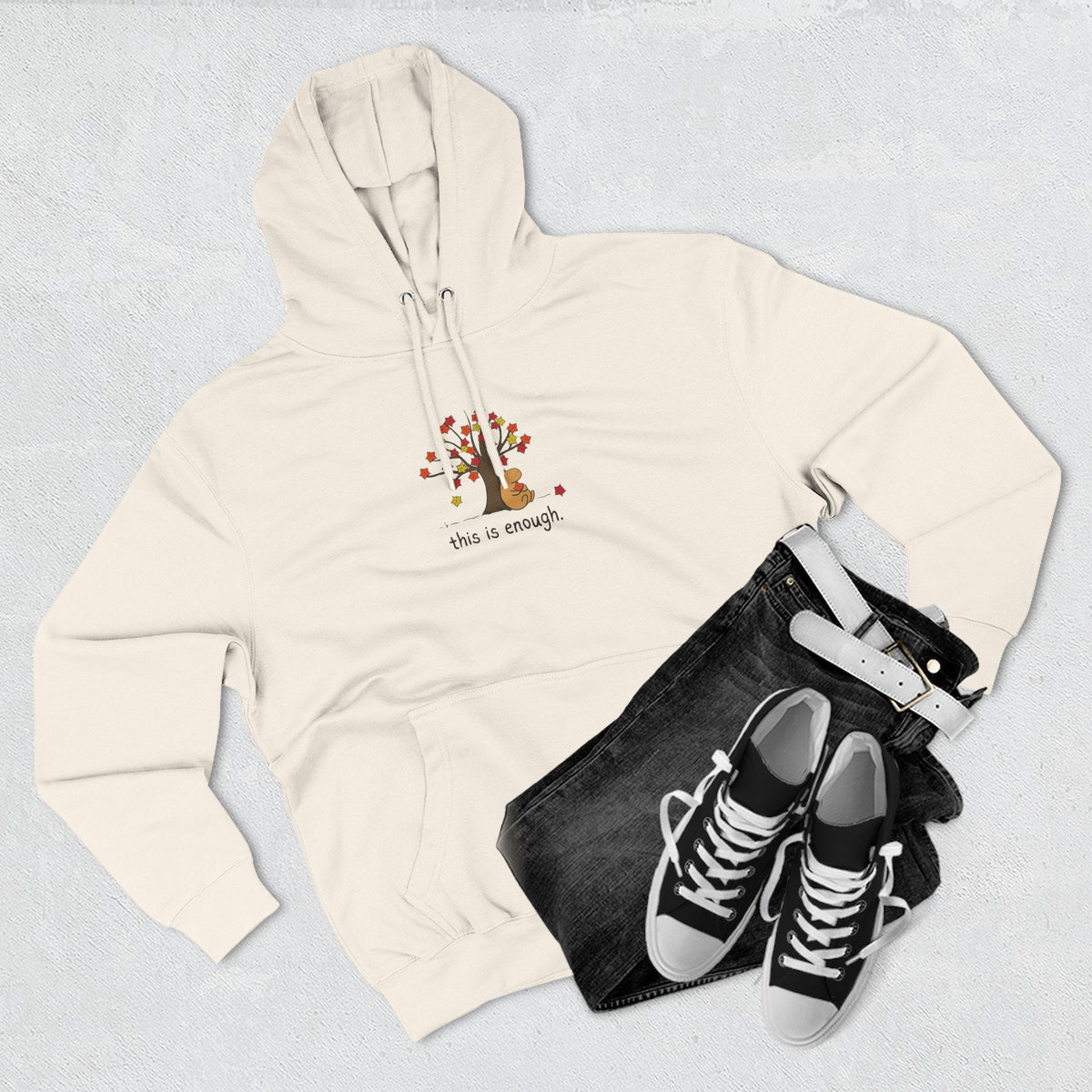 Capy Life cream fleece hoodie featuring Gene the capybara under an autumn tree with the text this is enough
