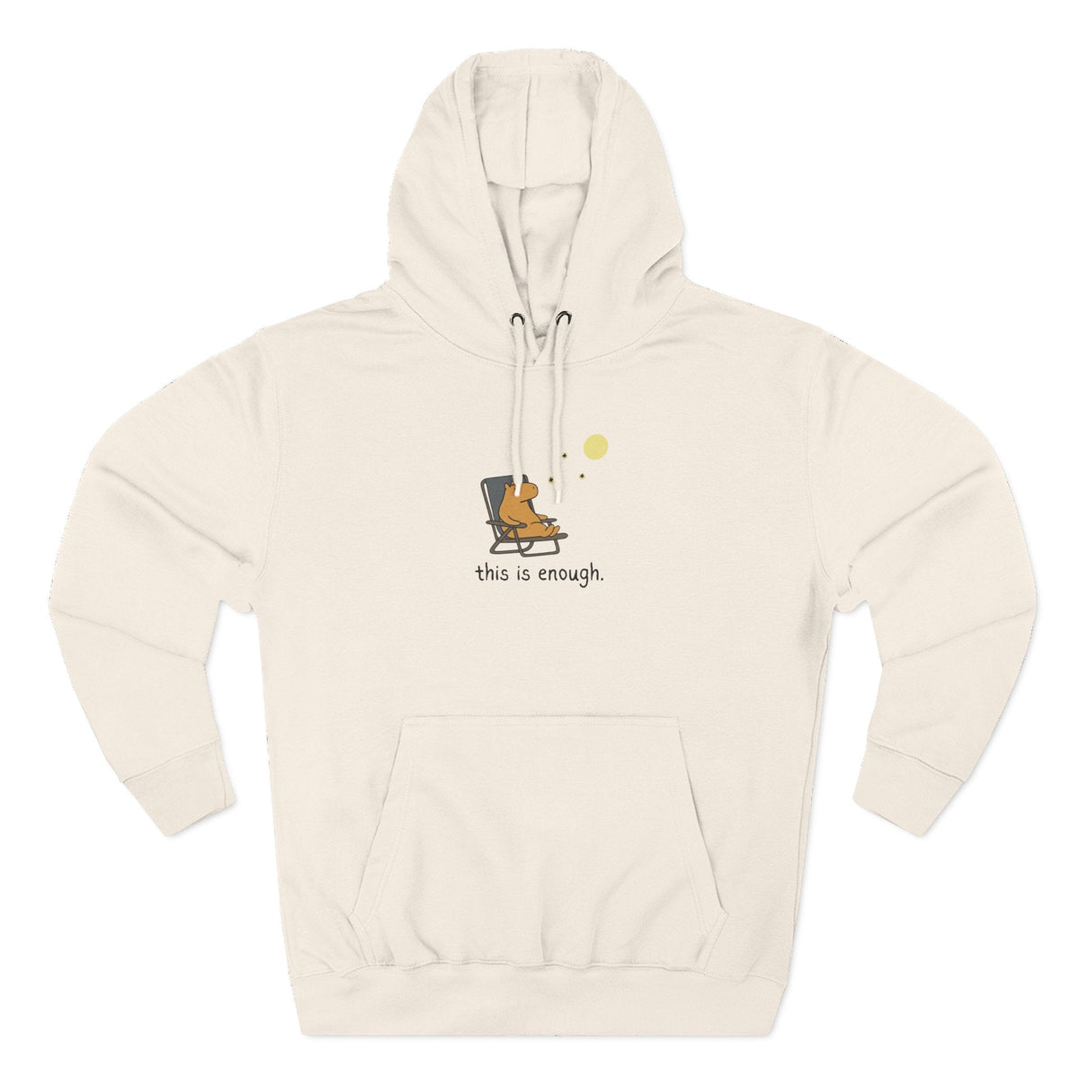 Capy Life cream fleece hoodie featuring a minimalist graphic of a capybara relaxing in a chair under a moon.