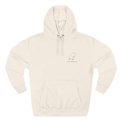 Capy Life cream-colored premium hoodie with a minimalist embroidered capybara design and Off to Shenan-again text.