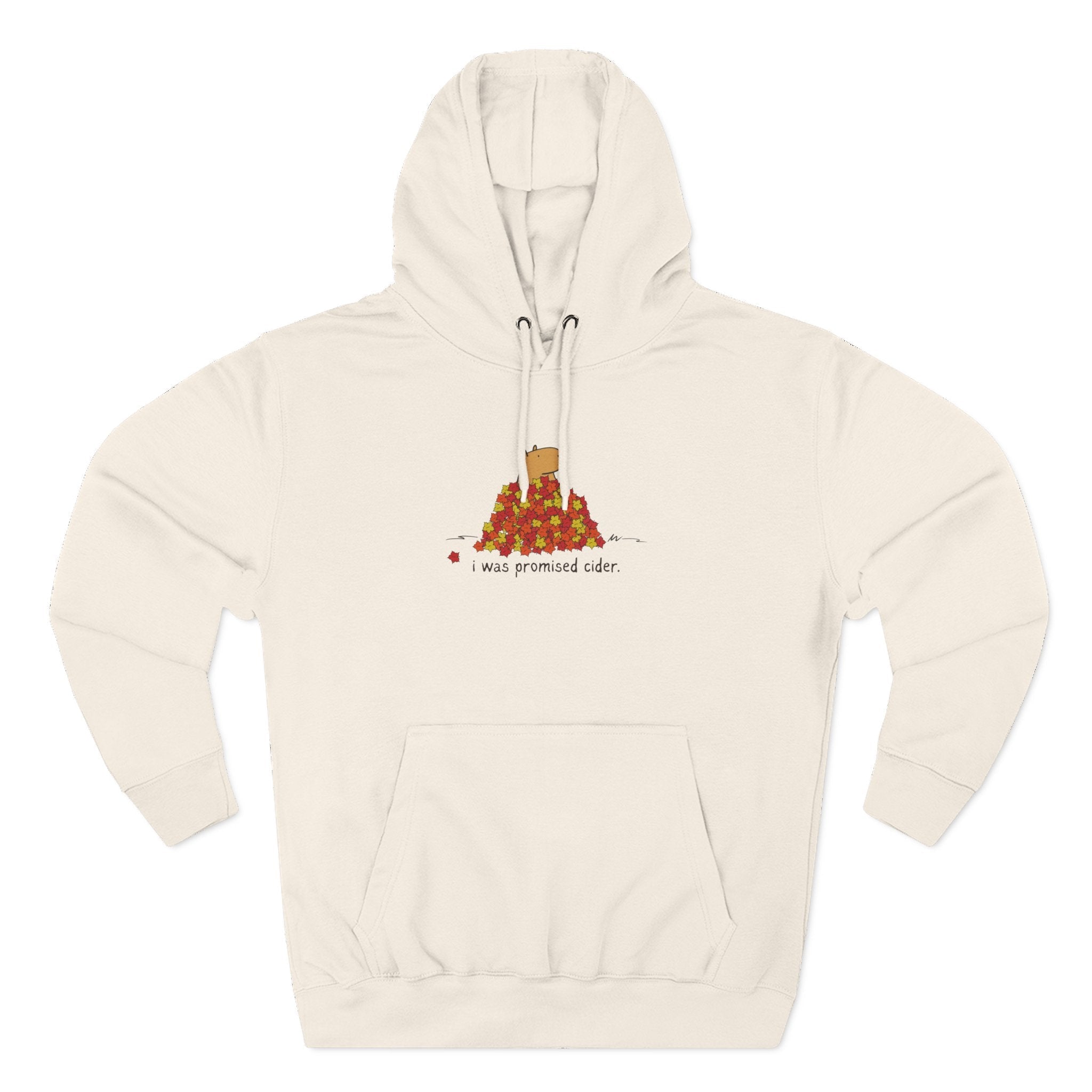 Capy Life cream fleece hoodie with a cute capybara in autumn leaves graphic and the text I was promised cider.