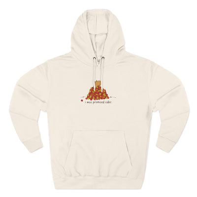 Capy Life cream fleece hoodie with a cute capybara in autumn leaves graphic and the text I was promised cider.