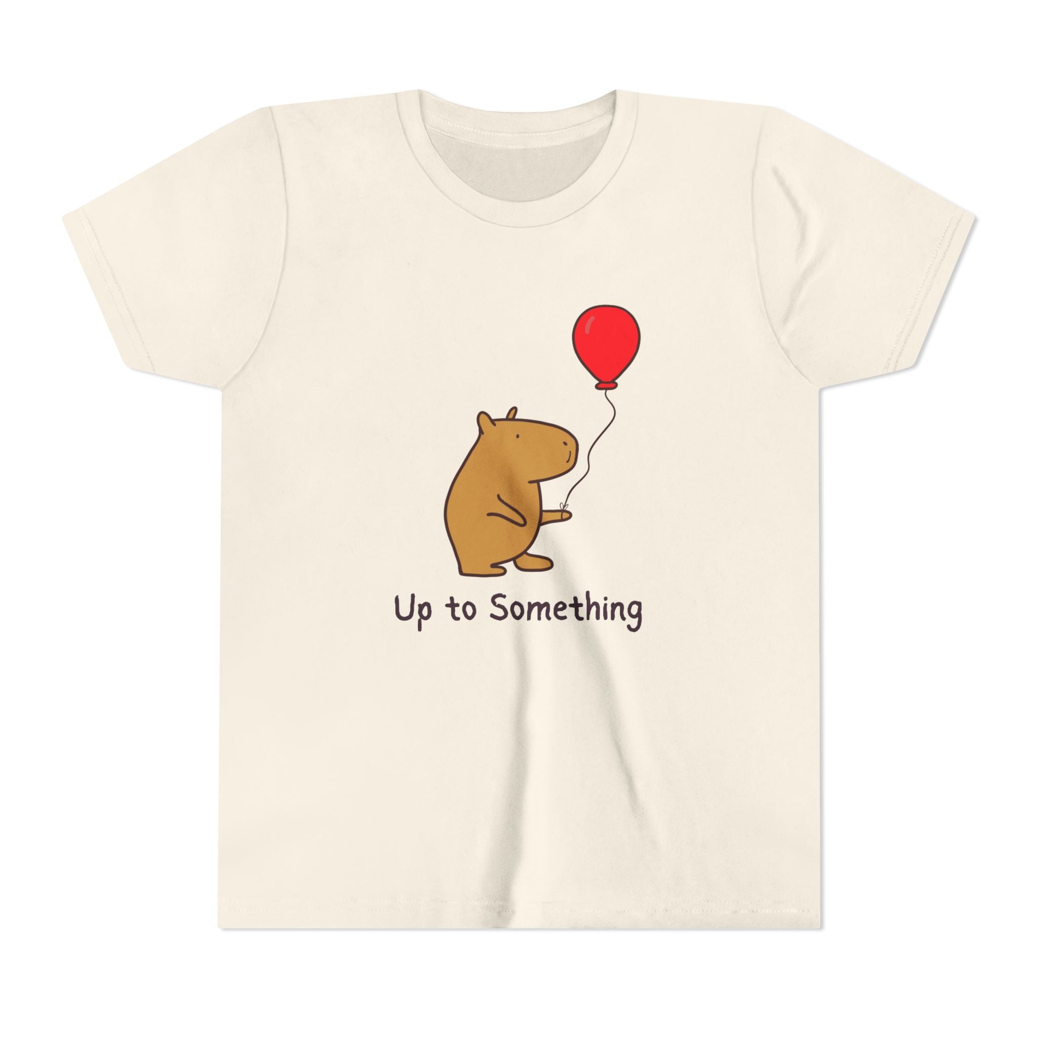 Capy Life youth tee in cream featuring a cute capybara holding a red balloon with the text Up to Something