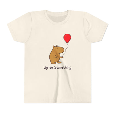Capy Life youth tee in cream featuring a cute capybara holding a red balloon with the text Up to Something