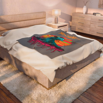Capy Life DJ Capybara fleece blanket with vibrant music-themed print draped on a modern bedroom bed.