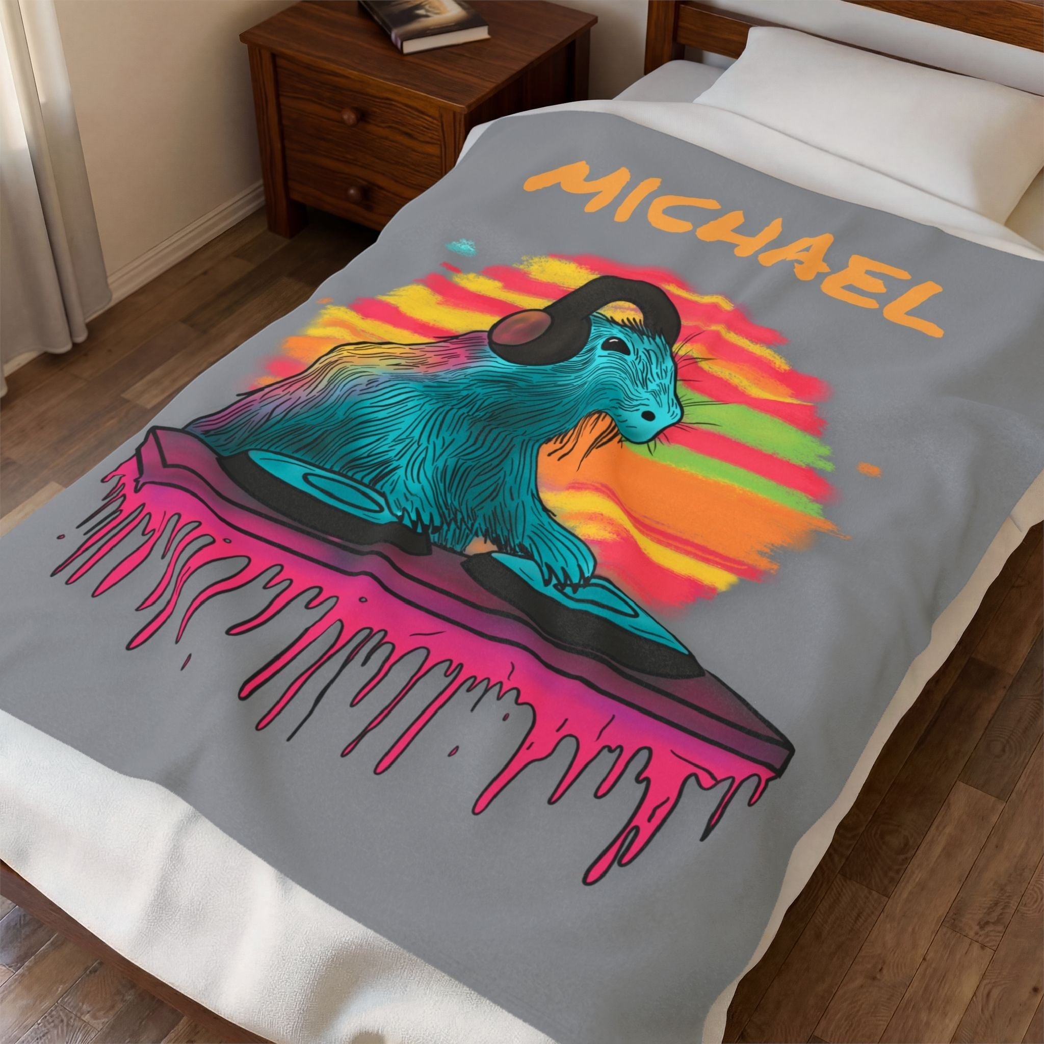Capy Life fleece blanket featuring a vibrant DJ capybara graphic with headphones on a grey velveteen background.