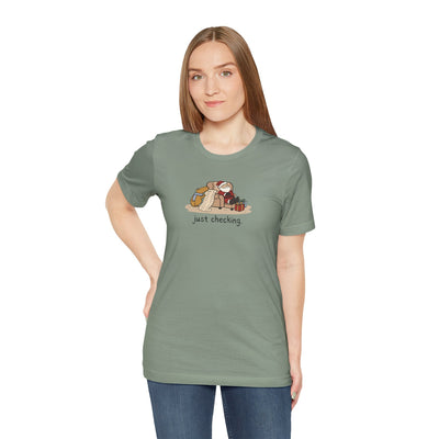 Capy Life softstyle t-shirt in sage green featuring a hand-drawn capybara checking Santa's naughty or nice list.