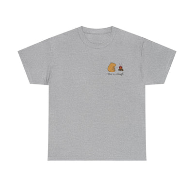 Capy Life grey heavyweight t-shirt with a small capybara roasting a marshmallow by a campfire on the left chest.