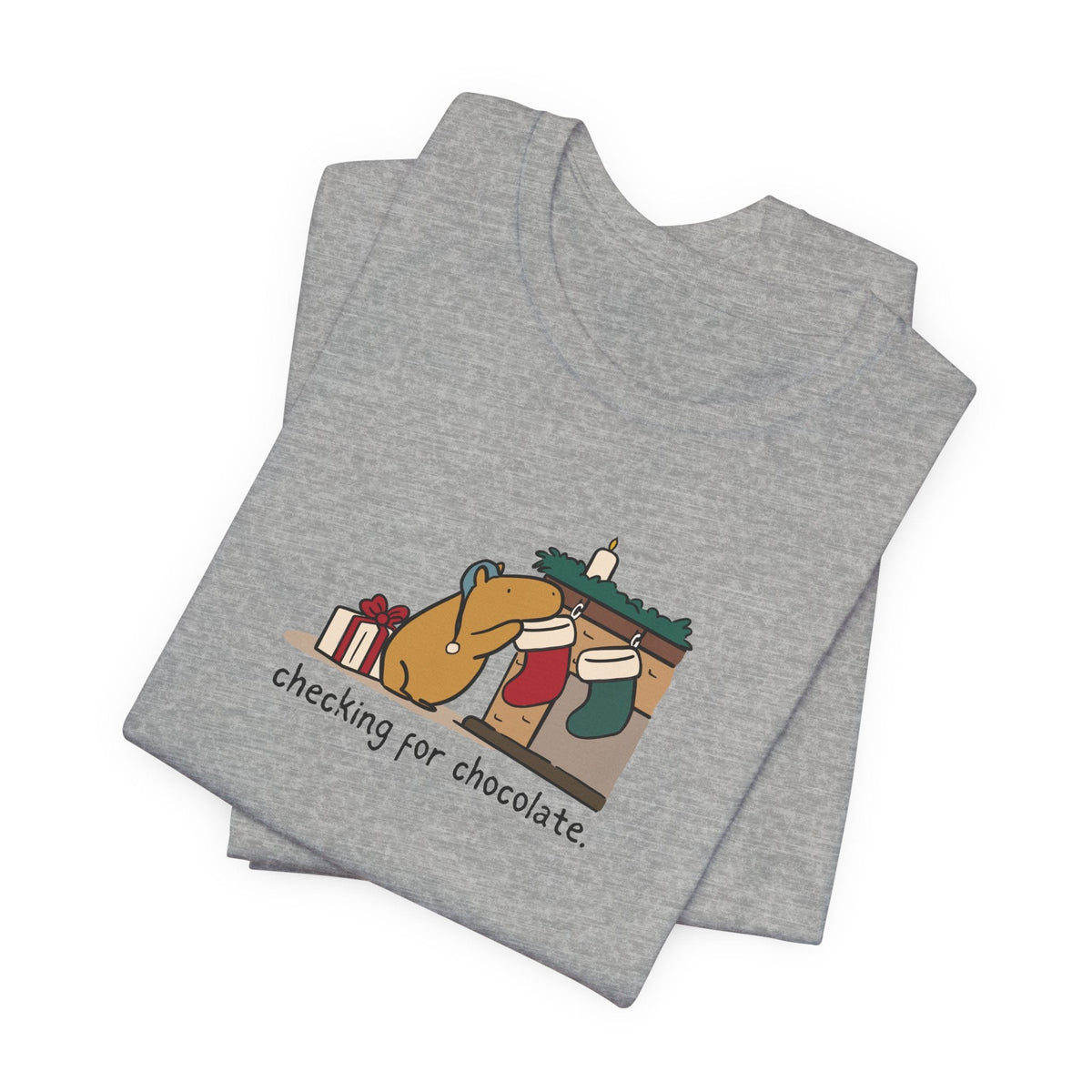 Capy Life grey softstyle t-shirt featuring a hand-drawn capybara checking a Christmas stocking for chocolate.