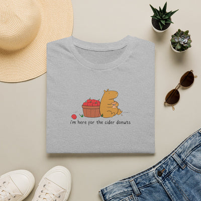 Capy Life grey softstyle t-shirt featuring a cute capybara eating a cider donut next to a basket of red apples.