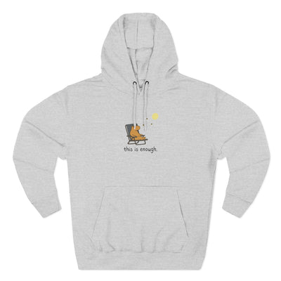 Capy Life grey fleece hoodie featuring a minimalist graphic of a capybara in a chair under a moon with text.