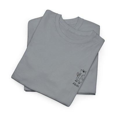 Capy Life grey heavy cotton t-shirt featuring a small left chest graphic of a capybara in a robe with the word Abide.