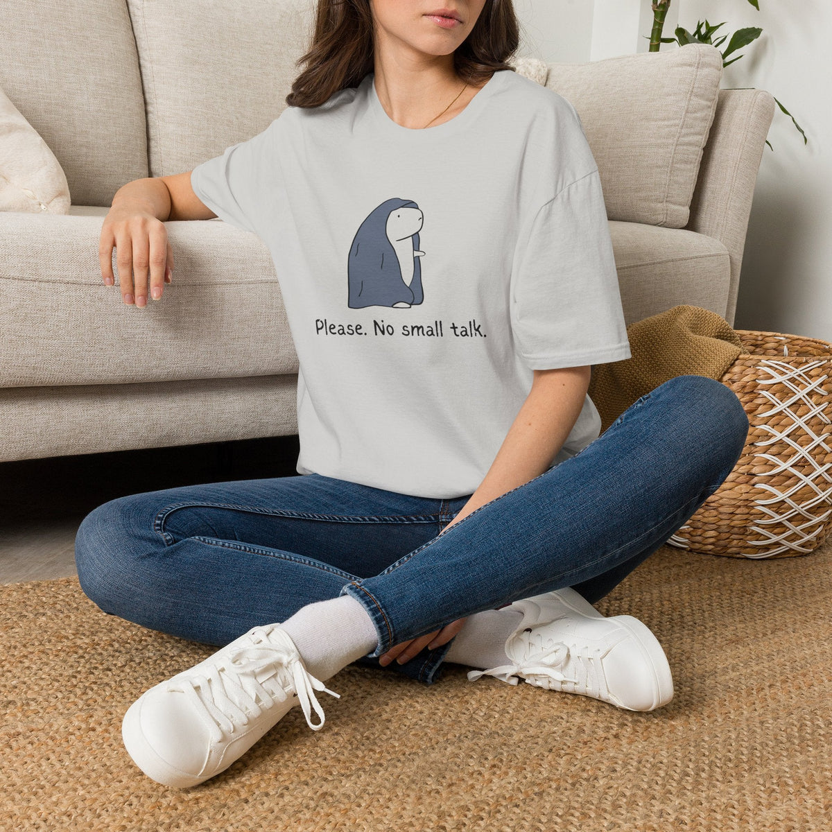 Capy Life light grey softstyle t-shirt featuring a capybara graphic and the text Please. No small talk. on a woman.