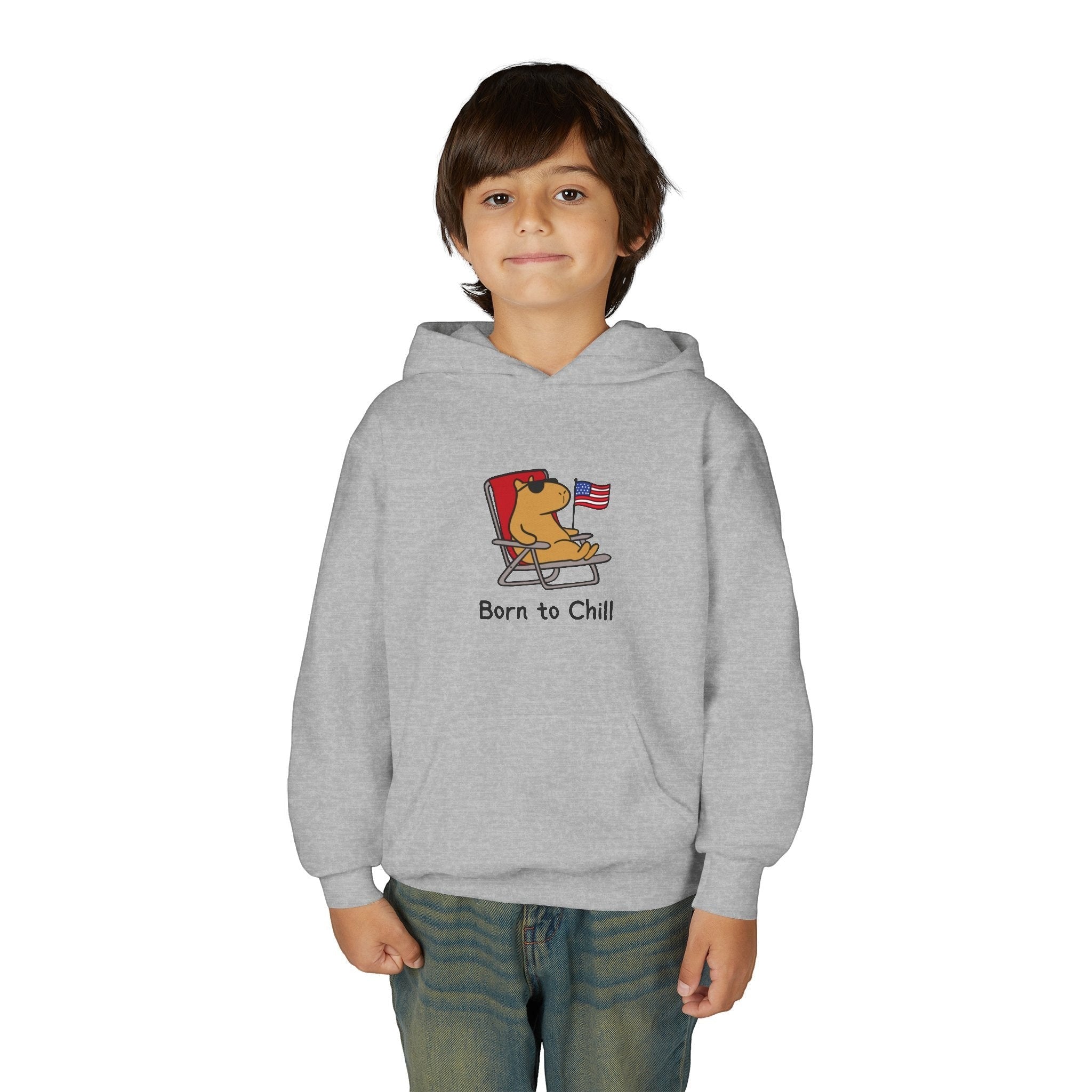 Capy Life youth grey hoodie featuring a capybara in sunglasses relaxing in a chair with an American flag