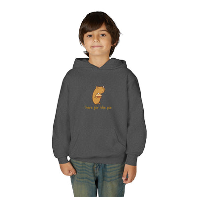 A young boy wearing a dark grey Capy Life kids hoodie featuring a cute capybara holding a slice of pie.