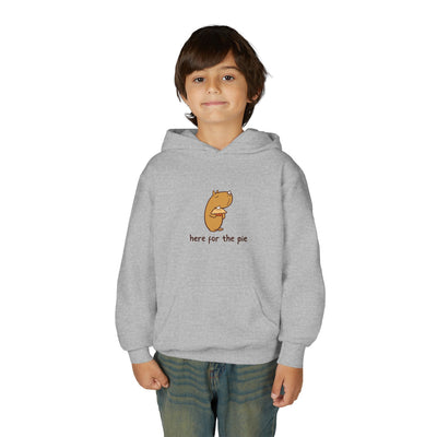 Child wearing a grey Capy Life hoodie featuring a cute illustration of a capybara holding a slice of pie.