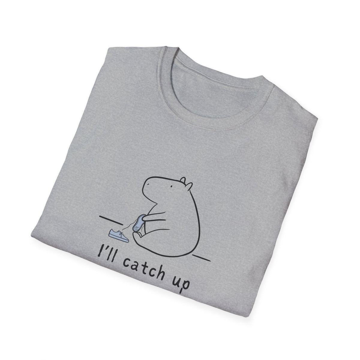 Capy Life grey softstyle t-shirt featuring a minimalist capybara illustration tying its shoe with text I'll catch up