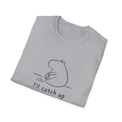 Capy Life grey softstyle t-shirt featuring a minimalist capybara illustration tying its shoe with text I'll catch up