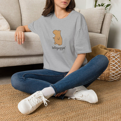 Capy Life softstyle grey t-shirt featuring a hand-drawn capybara illustration and the text lolligaggin on a woman.
