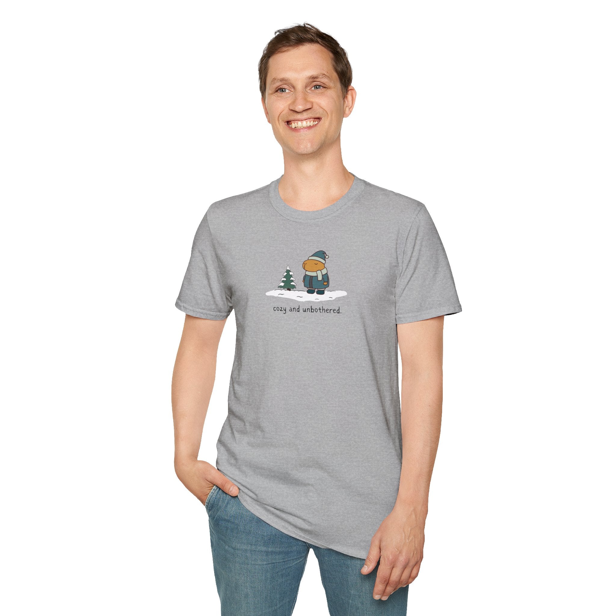 Capy Life grey softstyle t-shirt featuring a graphic of a capybara in winter gear with the text cozy and unbothered