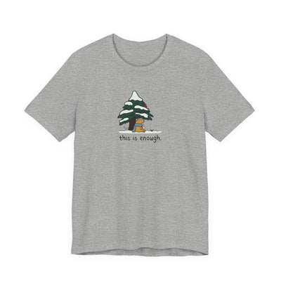 Capy Life grey graphic t-shirt featuring a capybara in a blue scarf under a snowy tree with the text this is enough