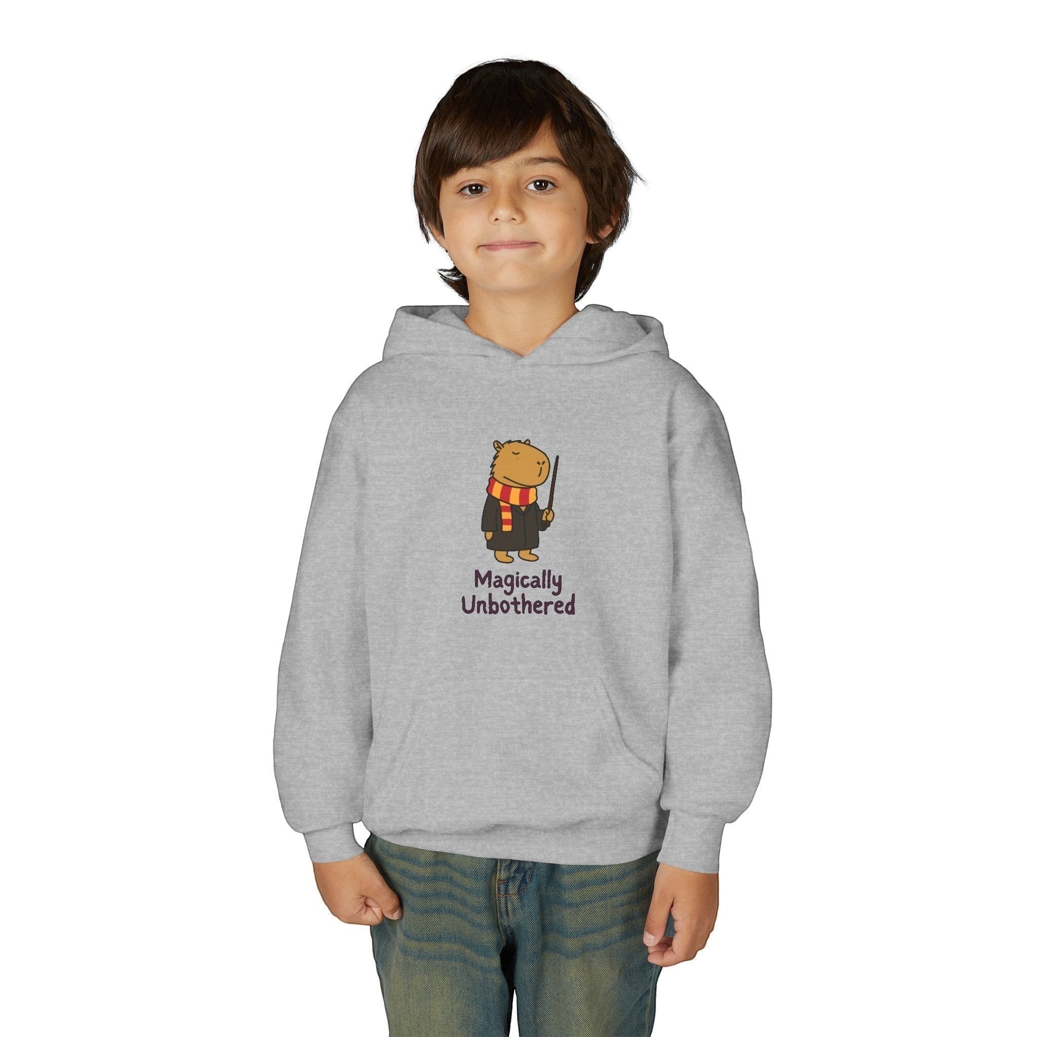 Capy Life kids grey hoodie featuring a cute capybara wizard graphic with the text Magically Unbothered