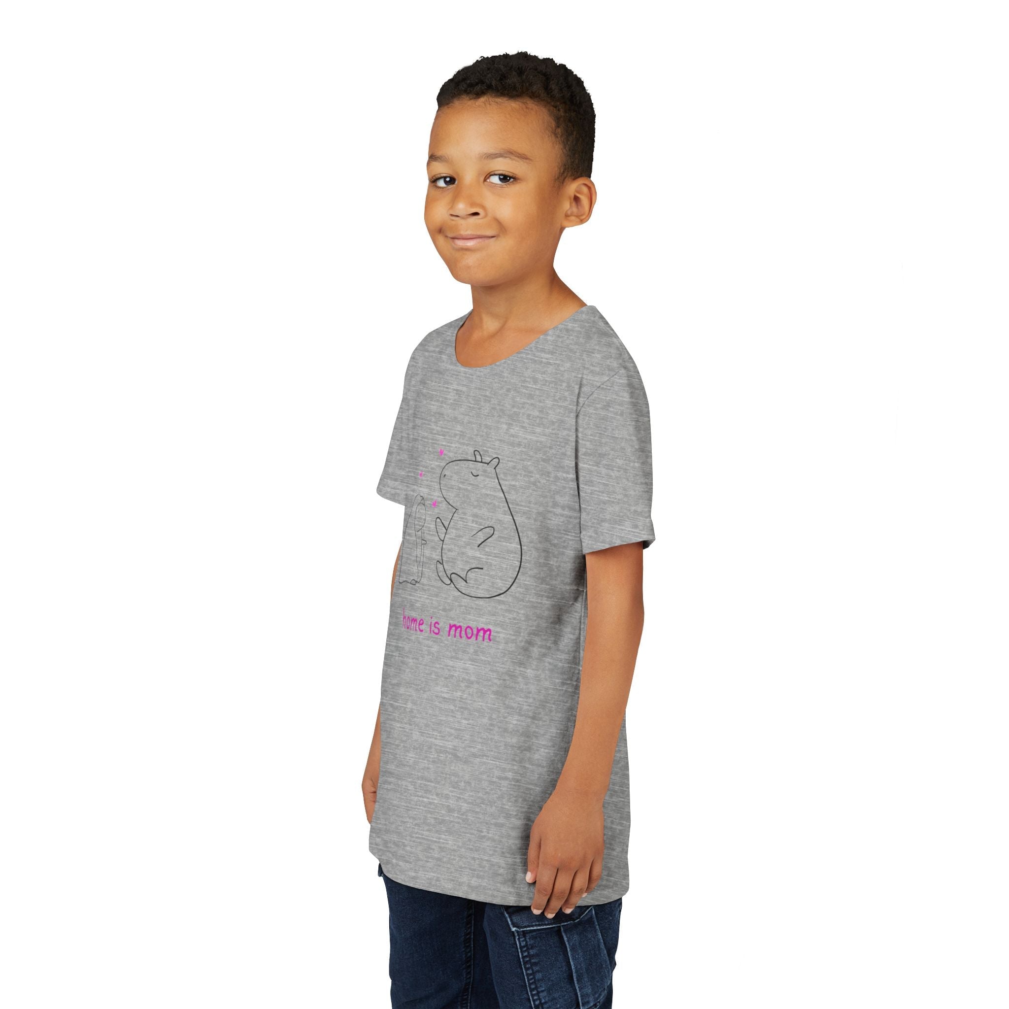 A young boy wearing a grey Capy Life kids t-shirt featuring a minimalist capybara illustration and home is mom text.