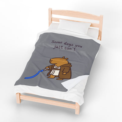 Capy Life velveteen plush blanket featuring a Jedi capybara with a lightsaber and the text Some days you just can't.