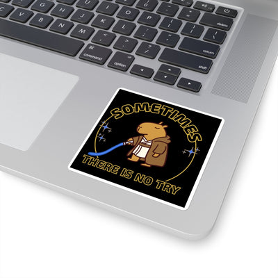 Capy Life sticker on a laptop featuring a capybara in a Jedi robe holding a blue lightsaber with gold text.