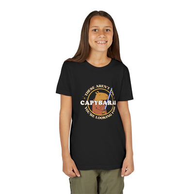 Young girl wearing a black Capy Life unisex youth t-shirt featuring a Jedi capybara comic badge graphic design.
