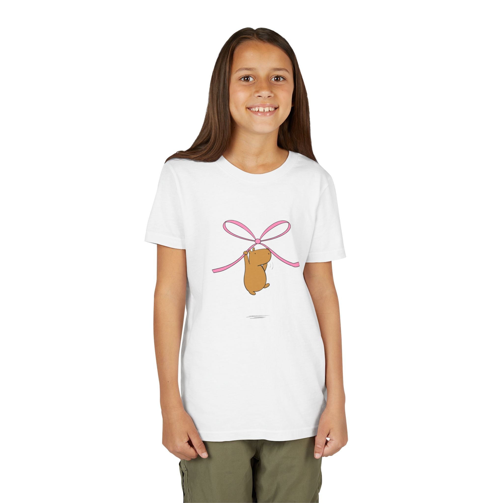 Capy Life kids white graphic tee featuring a cute capybara hanging from a pink coquette bow illustration