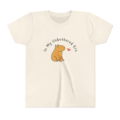 Capy Life kids t-shirt in cream featuring a cute capybara illustration and In My Unbothered Era text with a heart.