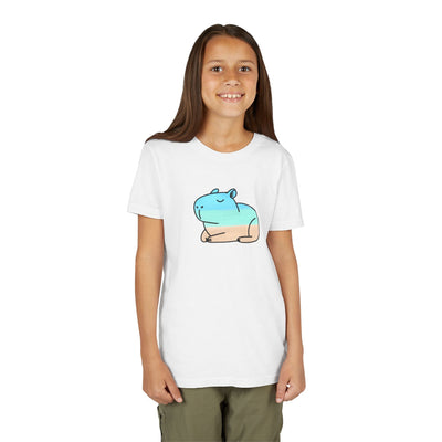 Girl wearing a Capy Life white cotton t-shirt featuring a hand-painted coastal capybara graphic in blue and tan.